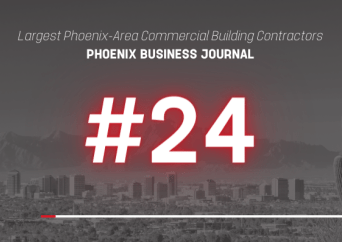 Graphic with a city skyline background, text reads Largest Phoenix-Area Commercial Building Contractors, PHOENIX BUSINESS JOURNAL, #24 in bold red and white letters.